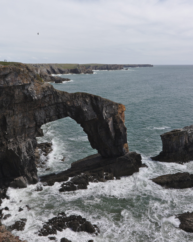 sea, breaking, solid, beauty in nature, no people, horizon, united kingdom, rock, land, nature, tranquility, beach, rock formation, day, sky, pembrokeshire coast national park
