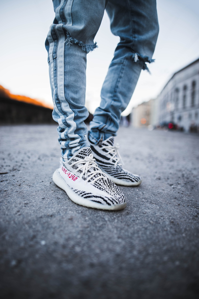 selective focus, modern wear, casual clothing, pavement, real people, transportation, day, jeans, salzburg, person, street, concrete, low section, zebra