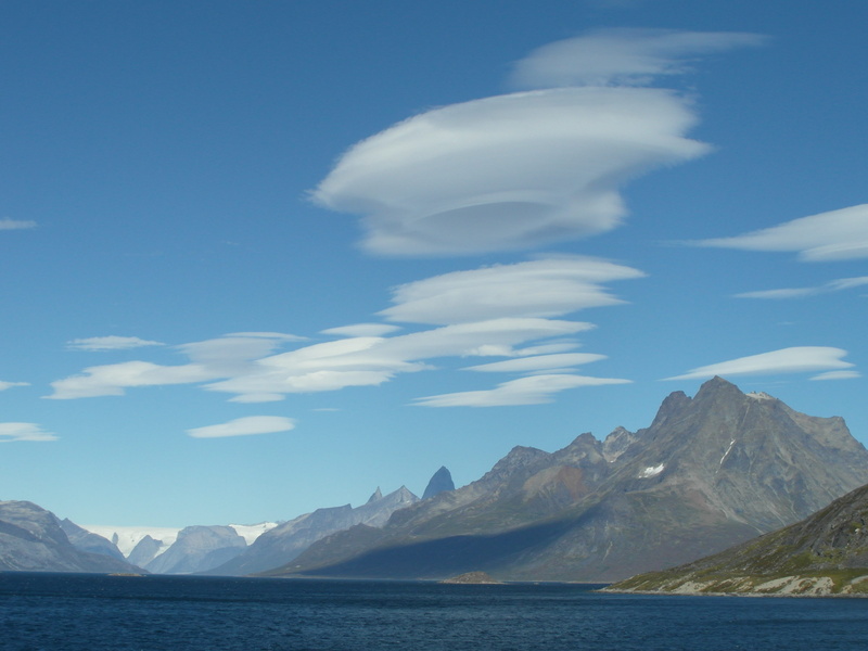 mountain range, greenland, sea, mountain, range, no people, lenticular, mountain peak, water, environment, formation, sky, nature, clouds, non-urban scene