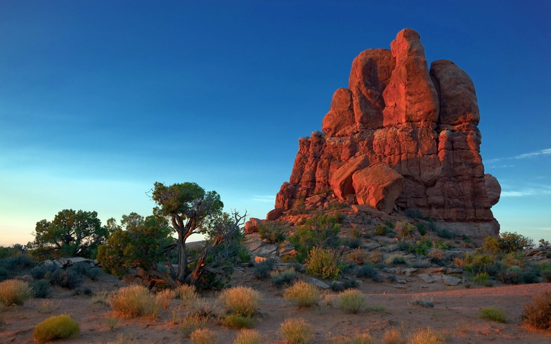 sky, non-urban scene, rocky, nature, no people, mountain, solid, geology, formation, beauty in nature, semi-arid, outdoors, environment, landscape, rock - object