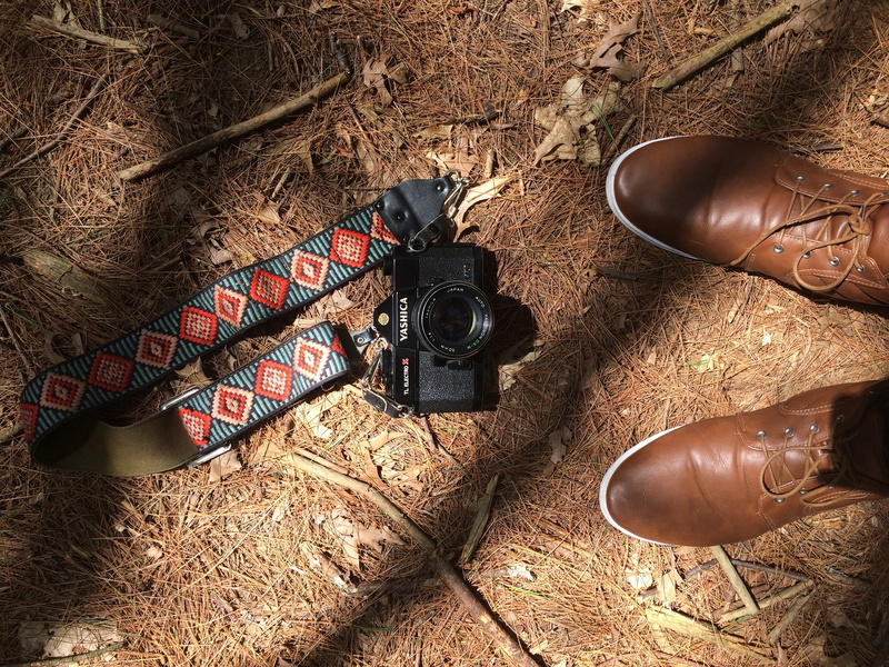high angle view, personal accessory, clothing, twigs, black, photography themes, activity, camera - photographic equipment, sunlight, directly above, technology