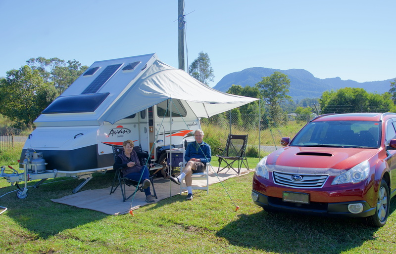 people, relax, traveler, land, caravan, trailer, campsite, transportation, real people, sky, men, tree, sunlight, camper, grass, holiday, clear sky, day