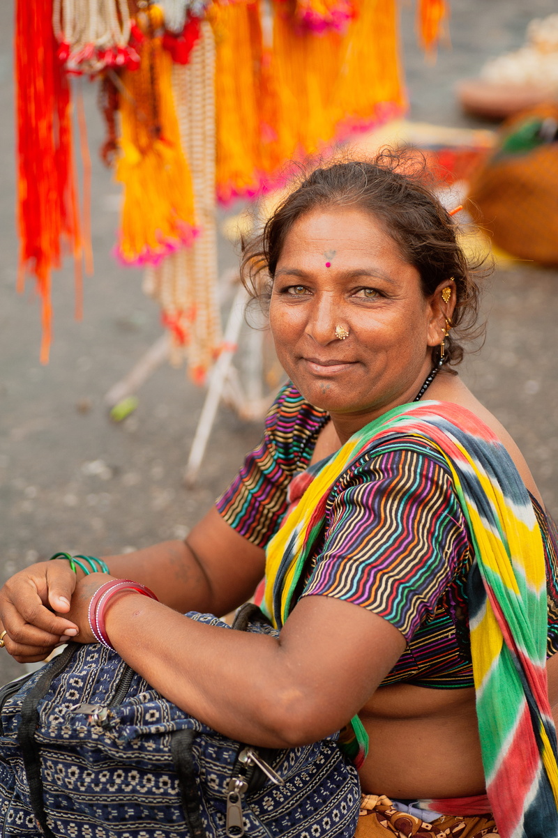 women, outdoors, portrait, colorful, hindu, one person, culture, facial expression, wear, face paint, looking at camera, sitting, traditional clothing