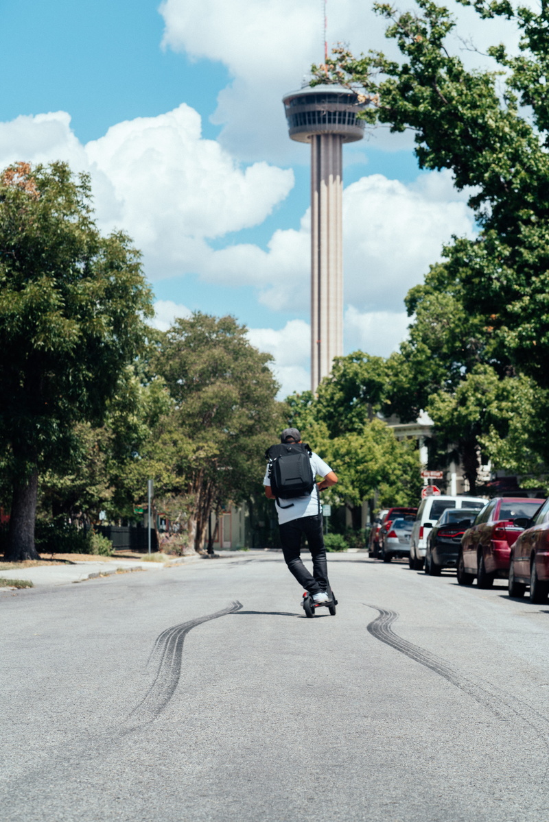 nearby, architecture, cloud - sky, plant, kick, transportation, scooter, men, building exterior, tree, lifestyles, day, built structure, full length, man
