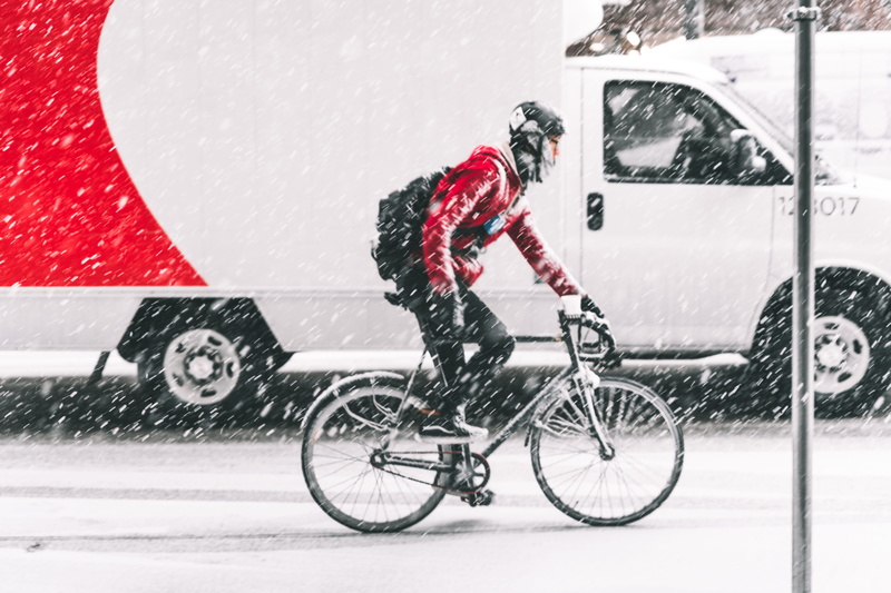 men, transportation, bike, motion, mountain, snow, vehicle, nearby, winter, cyclist, road, cold temperature, outdoors, real people, bicycle, red, white