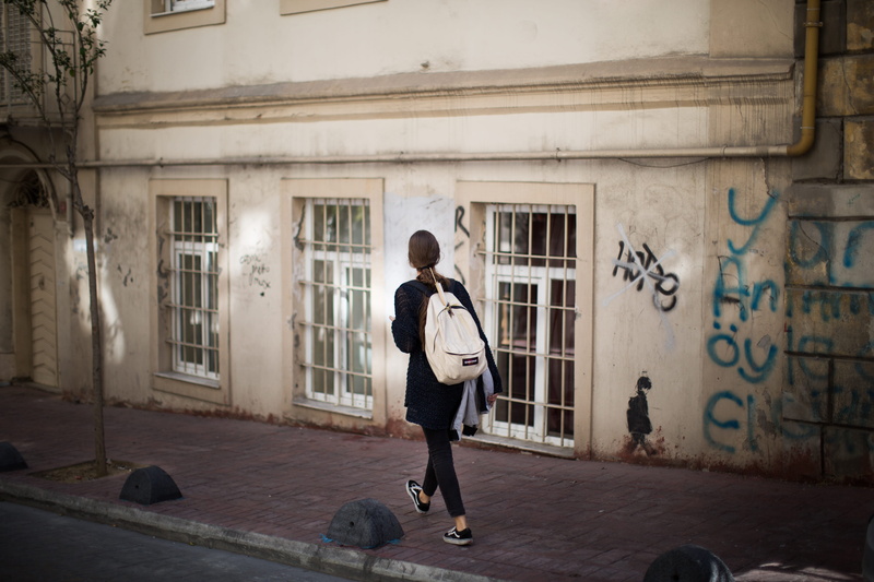 casual clothing, one person, structure, built structure, young adult, beige, concrete, woman, street, 5K, building, city, beside, real people, walking