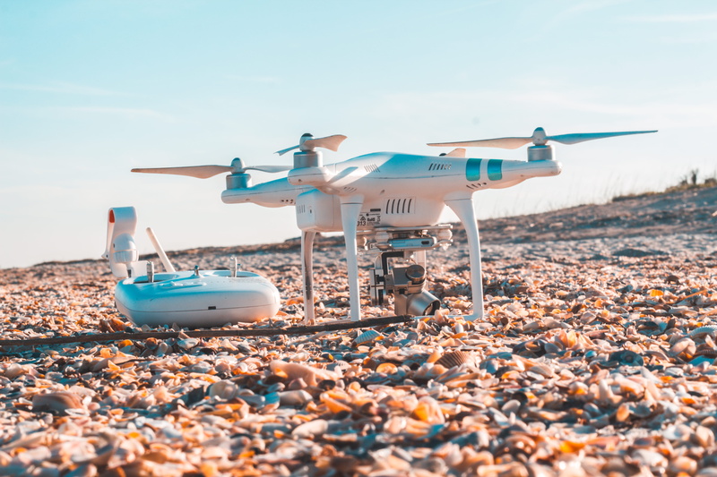 white, pebble, controls, sky, radio, nautical vessel, aircraft, copter, mode of transportation, no people, sea, drone, dji, land, rocky, 5K, travel, nature