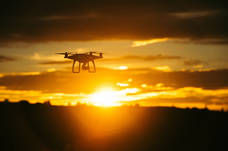 silhouette, flying, 4K, technology, orange color, aerospace Industry, scenics - nature, air Vehicle, sunlight, flight, surveillance, mode of transportation