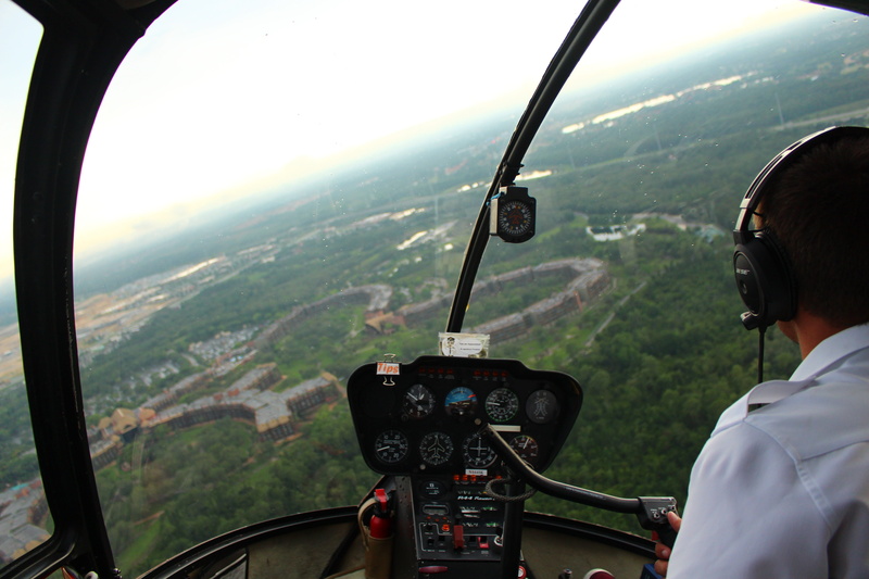outdoors, aircraft, flying, vehicle interior, aerospace industry, photography, mode of transportation, skill, uniform, rear view, windshield, pilot, one person