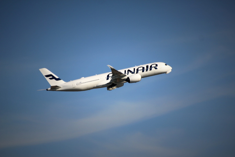 airplane wing, finnair, fly, plane, clouds, text, no people, aerospace industry, nature, western script, mode of transportation, fighter plane, sky, side view