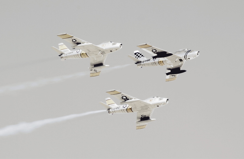 currency, single object, transportation, luxury, armed Forces, leaving, reflection, high angle view, airshow, aerospace industry, paper currency, fighter Plane