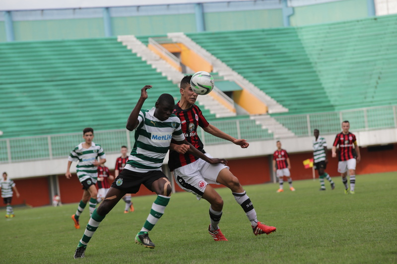 focus on foreground, outdoors, playing, offense - Sporting Position, field, playing soccer, win, sports Uniform, sports Team, teenager, foot, player, sport