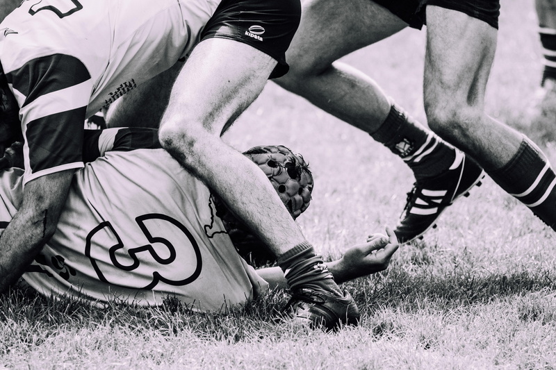 sports clothing, black-and-white, game, athlete, sport, sports equipment, body part, human body part, action, human leg, field, real people, competition