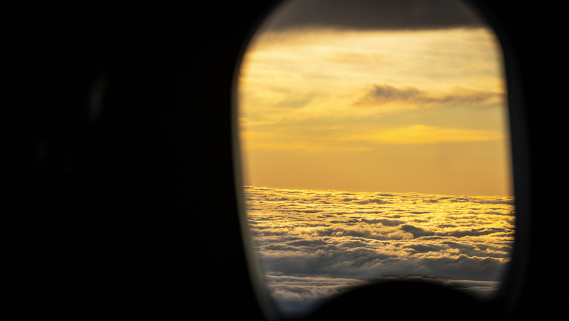 sphere, beauty in nature, window, sunset, fly, over the clouds, looking, no people, travel, sunlight, journey, air vehicle, transportation, orange color