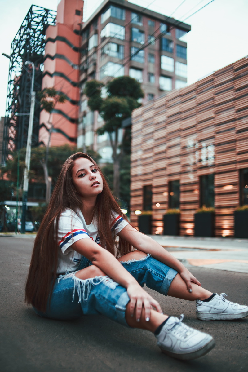 street, lifestyles, long hair, woman, beautiful woman, building, built structure, daytime, day, road, gray, young, architecture, hairstyle, streetwear