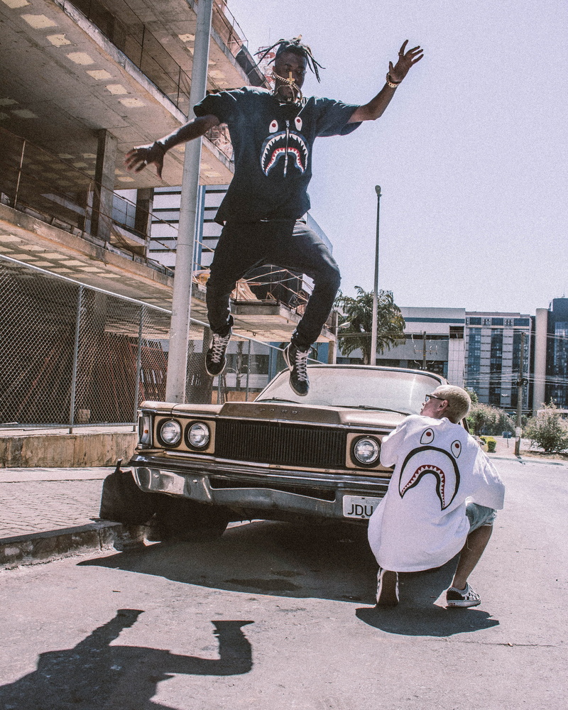 brown, car brand, wear, man, landscape, front, jumping, urban style, streetwear, day, human arm, urban photography, street, architecture, people, urban scene