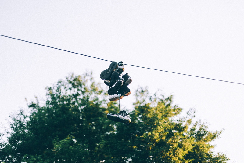 cable car, tree, color, assorted, clear sky, overhead cable car, shoes, sky, cable, connection, hanging, full length, transportation, growth, bokeh, one person
