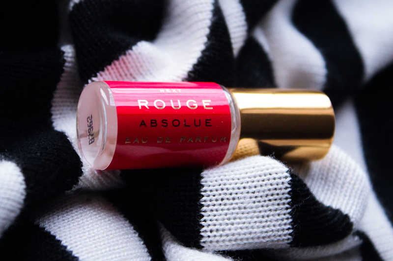 close-up, container, red, bottle, focus on foreground, indoors, no people, fashion, grand piano, still life, text, textile, gold, lipstick, warm clothing