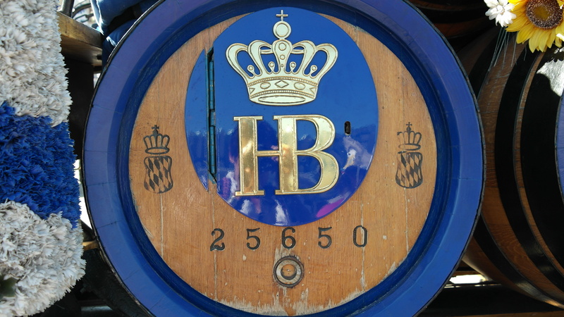building, barrels, close-up, munich, day, male likeness, sign, communication, architecture, beer, white, text, 5K, art and craft, tradition, wood, human representation