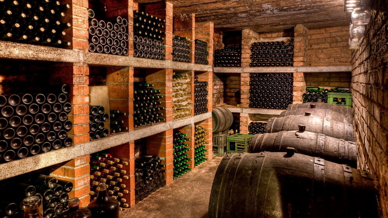 wine bottle, wine, bottle, dust, order, refreshment, container, stack, food and drink, drink, large group of objects, wine rack, alcohol, red wine, in a row