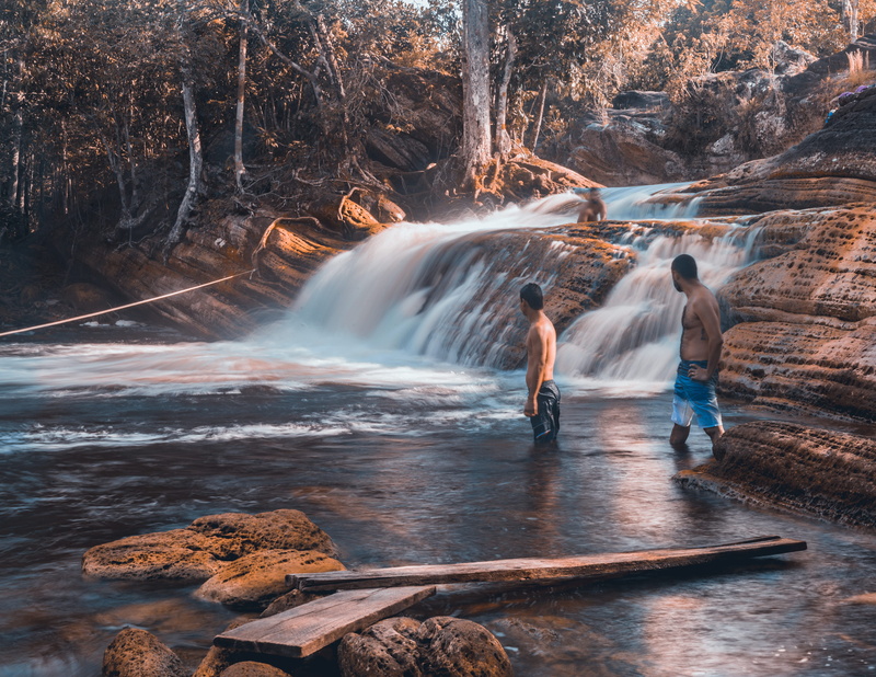 solid, motion, rock, waterfall, water, cachoeira da porteira, lifestyles, 4K, people, outdoors, flowing water, amazing, rear view, tree, rock - object