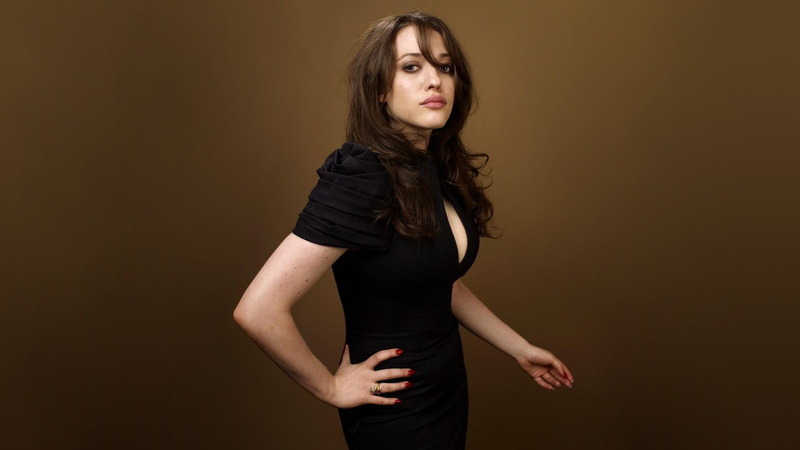 black dress, dress, black, looking at camera, long hair, brunette, fashion, colored background, beautiful woman, beige background, one person, indoors