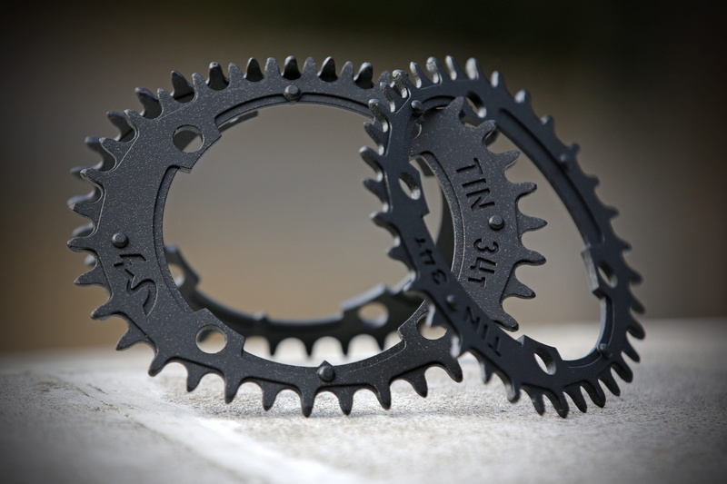 studio shot, close-up, 4K, colored background, industry, interlocked, selective focus, machinery, chainring, equipment, bikes, metal industry, oval chainring