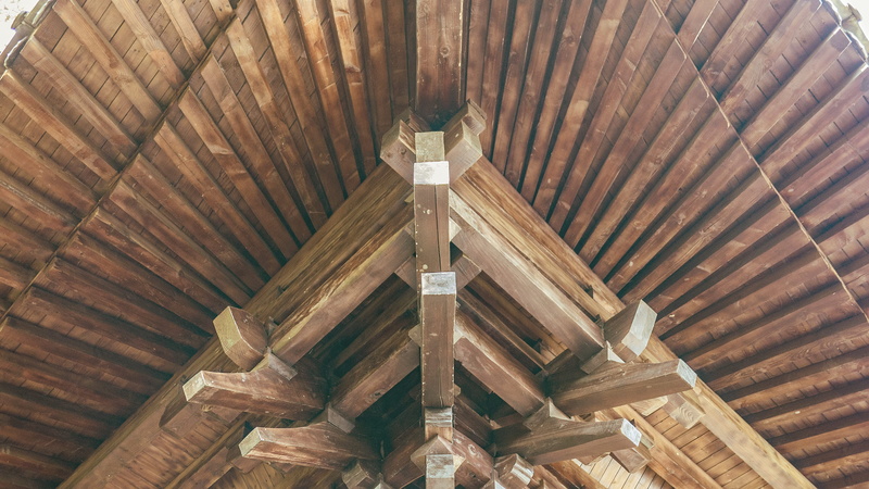 architectural feature, day, high angle view, indoors, backgrounds, roof, no people, pillar, plywood, flooring, built structure, arched, roof beam, pattern
