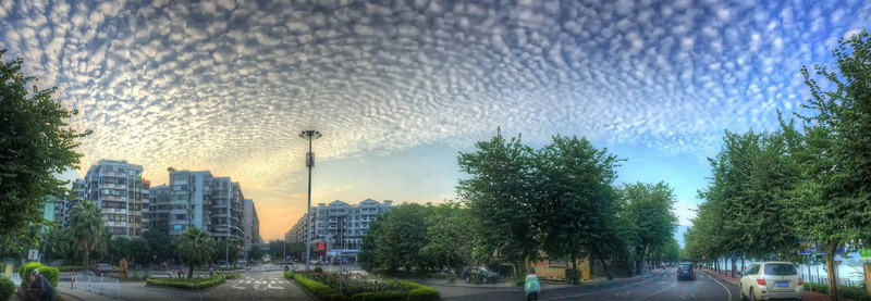 cloud - sky, built structure, transportation, outdoors, skyscraper, building exterior, sky lanterns, mode of transportation, city, architecture, tree, street