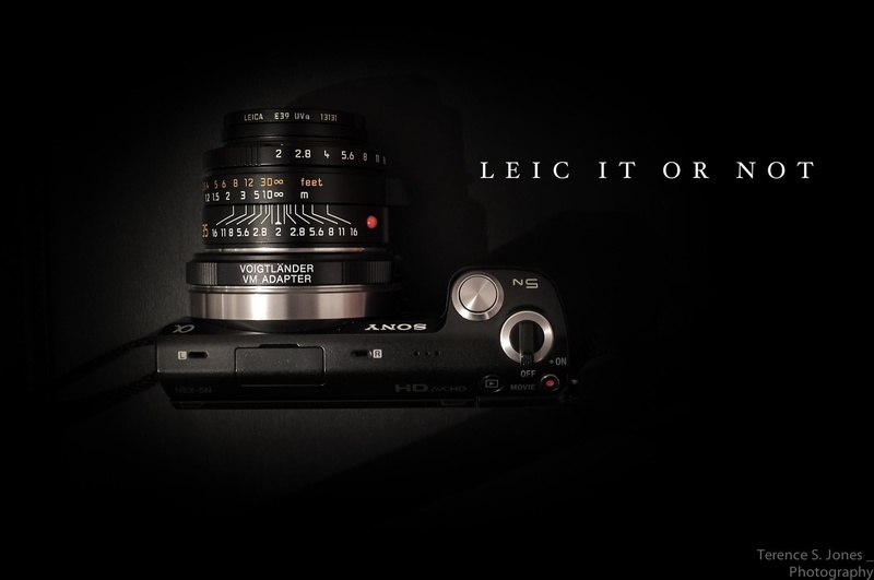 black background, indoors, close-up, photographic equipment, retro styled, lens - eye, 1080P, antique, western script, no people, lens - optical instrument