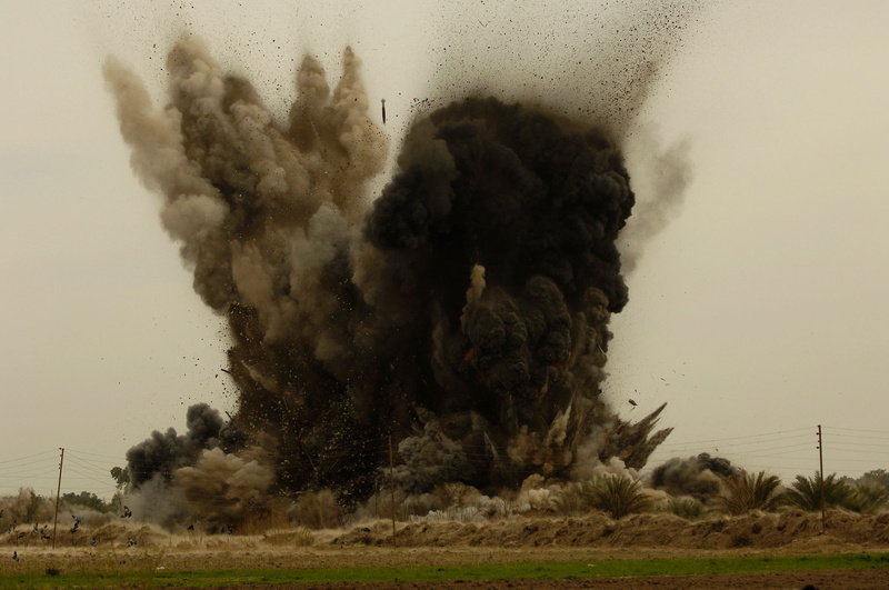 motion, outdoors, environment, burning, smoke - physical structure, field, sign, exploding, landscape, explosion, power in nature, communication, weapon