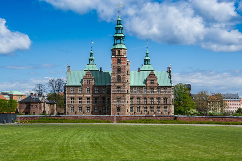 built structure, denmark, building exterior, spire, grass, 4K, green color, city, cloud - sky, travel destinations, nature, copenhagen, lawn, castle, sky