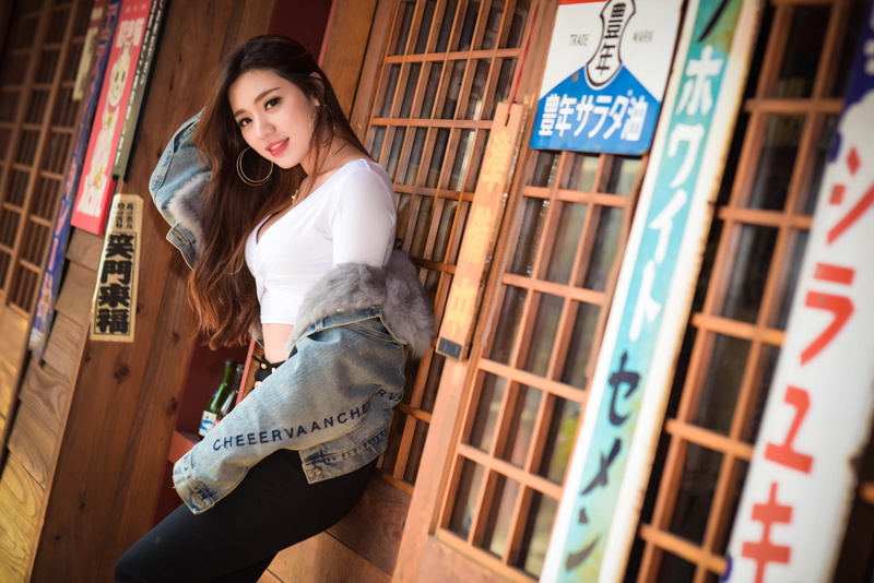 long hair, women, women outdoors, jacket, jeans, 2K, side view, smiling, portrait, cleavage, brown eyes, jeans jacket, Asian, hoop earrings, red lipstick
