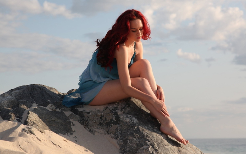 rock, beautiful woman, outdoors, sitting, hairstyle, redhead, women outdoors, rock - object, long hair, beauty in nature, real people, leisure activity
