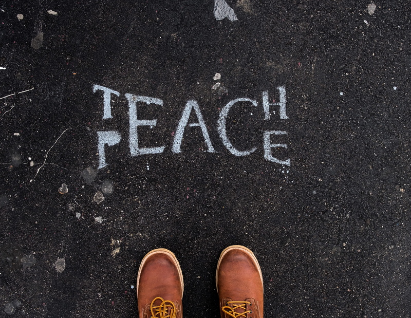 low section, personal perspective, outdoors, standing, shoe, road, 4K, western script, text, guidance, human body part, high angle view, sign, surface
