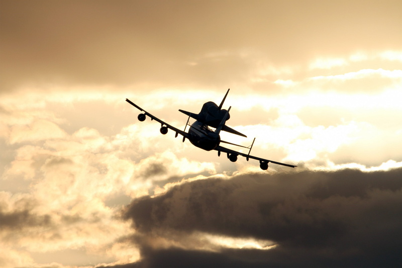 sky, Discovery, mode of transportation, cloud - sky, orange color, travel, transportation, outdoors, low angle view, on the move, aircraft, airplane, silhouette