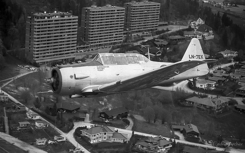 north american t6 harvard, airplane, no people, fly, 5K, building, architecture, over drammen, day, transportation, water, skyscraper, nature, city, building exterior