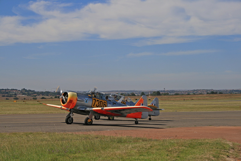 aircraft, clouds, airplane, aerospace industry, transportation, air force museum, outdoors, dayglo, harvard, aviation, trainer, air vehicle, airport runway