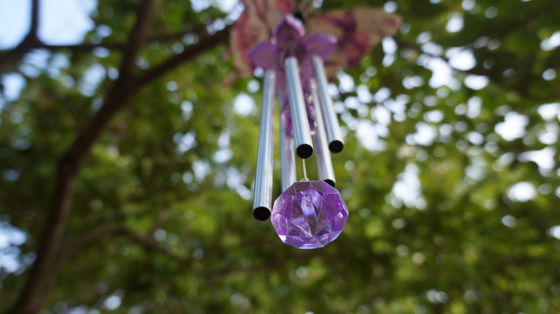 decorative, selective focus, beauty in nature, sunlight, windchime, tree, low angle view, outdoors, day, no people, crystal, plant, focus on foreground