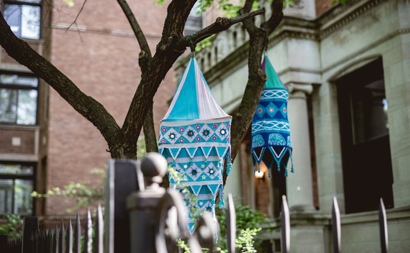 building, puppet, hanging, fence, selective focus, metal, 5K, decorations, home, celebration, blue, decor, outdoors, shape, shapes, pink, architecture