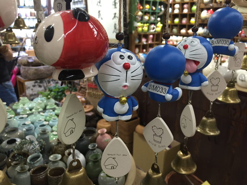 small business, variation, close-up, choice, day, focus on foreground, doraemon, 2K, toys, no people, manga, business, japanese, decoration, large group of objects