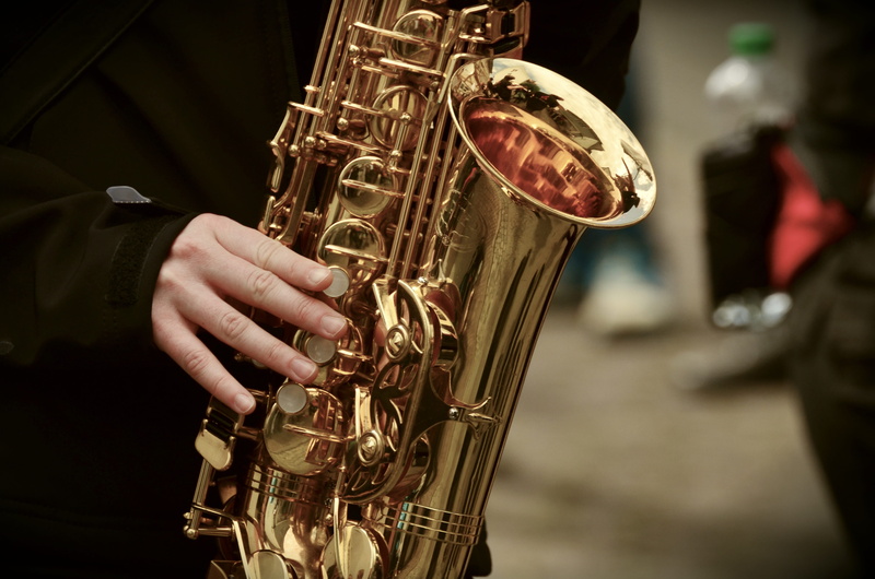human body part, midsection, musical equipment, music, one person, 4K, real people, saxophone, holding, performance, person, finger, brass instrument