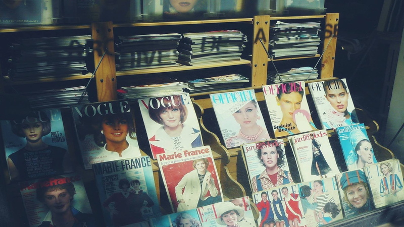 text, collection, retail, arrangement, vintage, for sale, Retro style, albums, variation, human representation, male likeness, female likeness, assorted