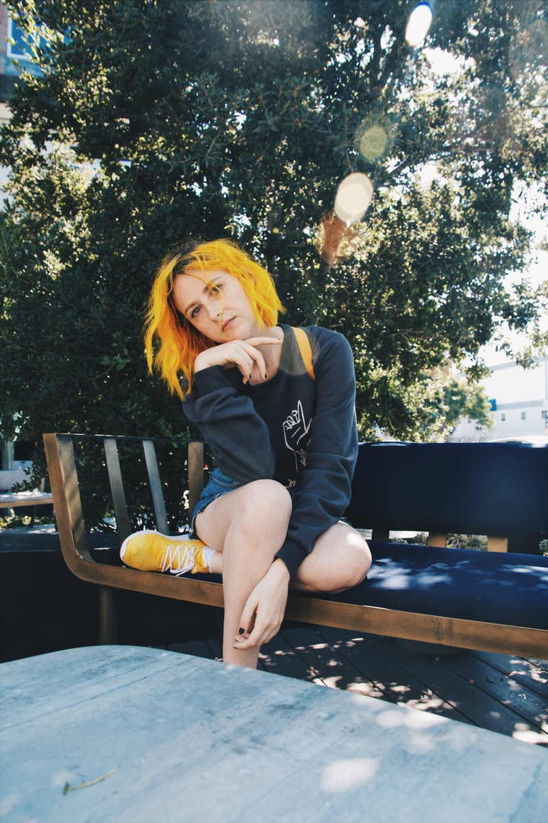 looking at viewer, 720P, women, sitting, Tessa Violet, women outdoors, yellow hair