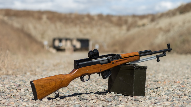 focus on foreground, target shooting, machine gun, carabiner, hunting, military, desert, day, sign, shooting a weapon, nature, rifle, brown, self-loading