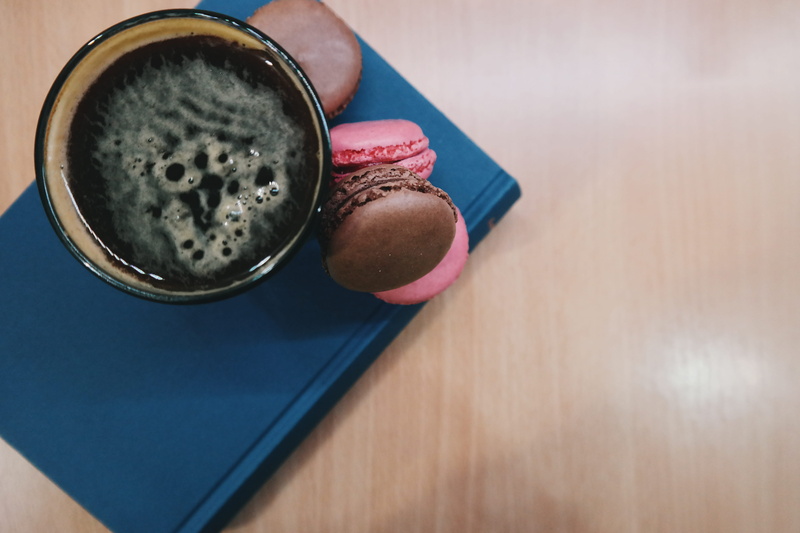 one person, mug, food and drink, indoors, coffee cup, textures, macaroons, dessert, still life, coffee - drink, high angle view, drink, black coffee, french macaroons