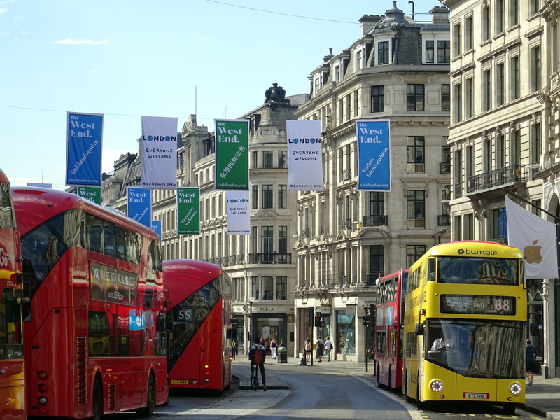 building, pavement, men, nature, road, architecture, downtown, incidental people, tram, daylight, public transportation, town, banner, outdoors, cable car