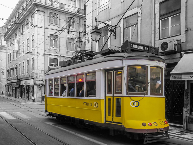 architecture, urban, yellow, built structure, incidental people, rail transportation, railway, train, city, window, land vehicle, railroad track, transport system