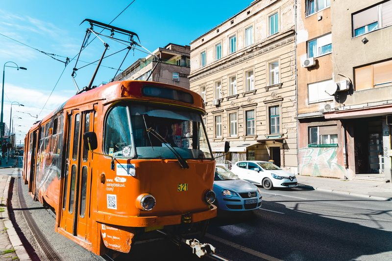 buildings, track, transportation system, orange, railroad track, motor vehicle, locomotive, road, land vehicle, cars, nature, building exterior, railway