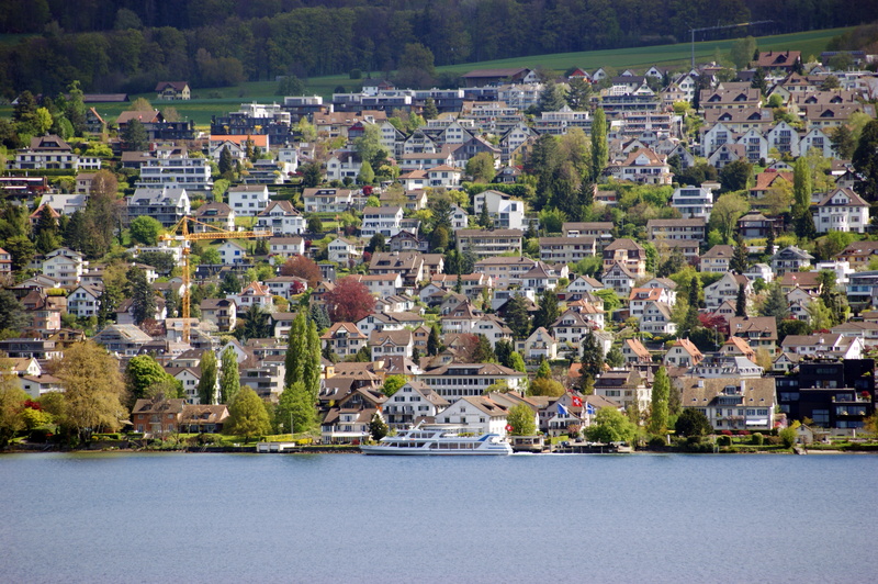 bank, passenger ferry, building, plant, building exterior, built structure, community, lakeside, trees, nature, outdoors, residential district, high angle view